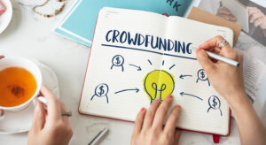 Crowdfunding concept in notebook