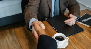 Handshake over a coffee meeting