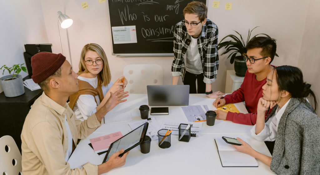Group brainstorming in conference room