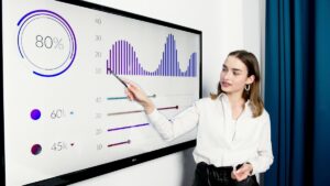 Woman presenting data on screen