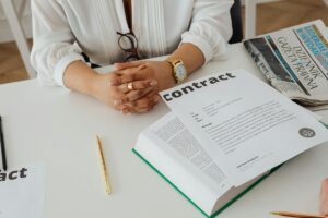 Hands on a contract document