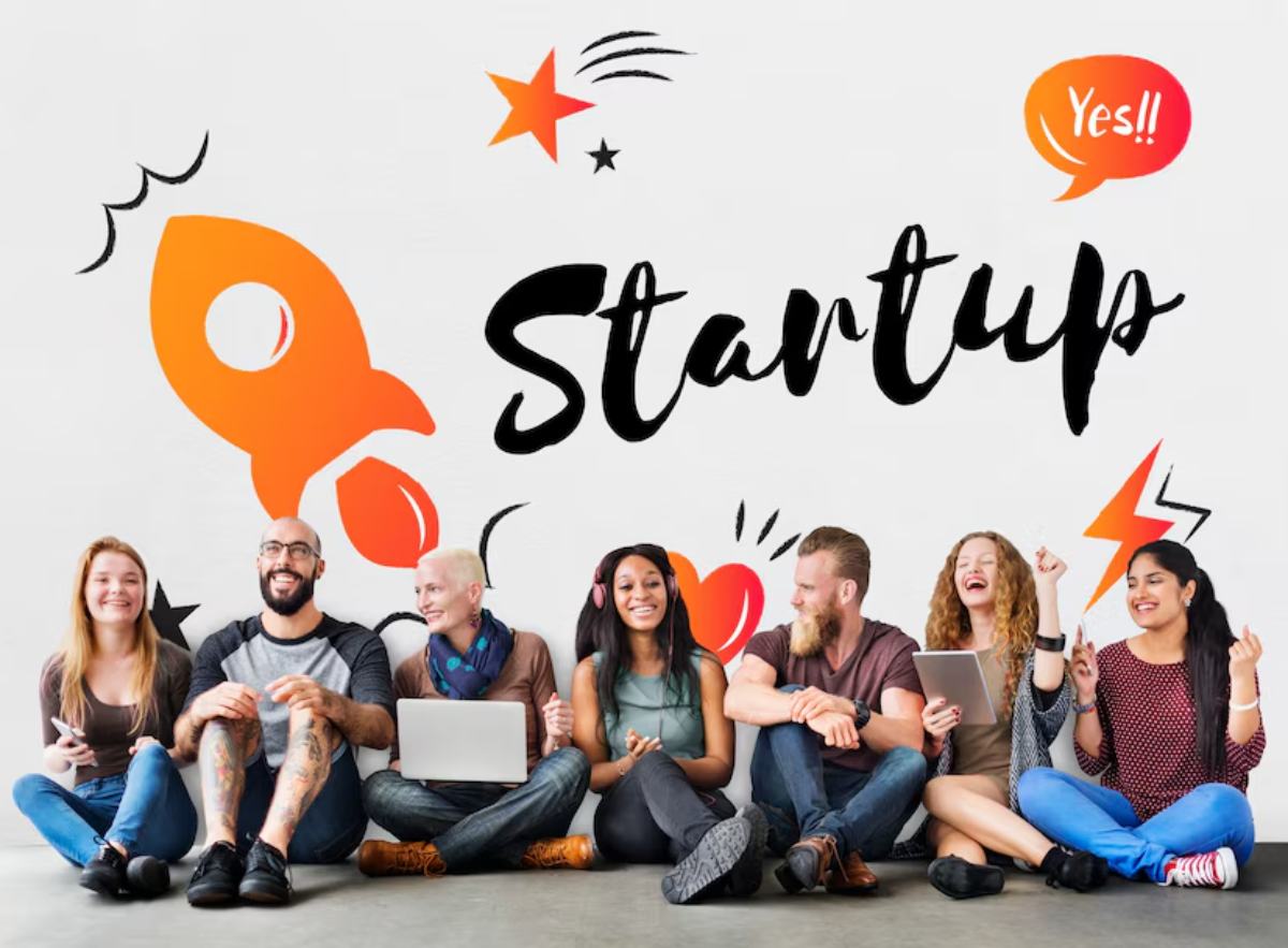 A diverse group of young adults sits together against a colorful 