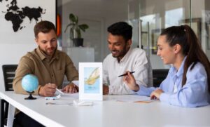 A collaborative meeting at a modern office, featuring a globe